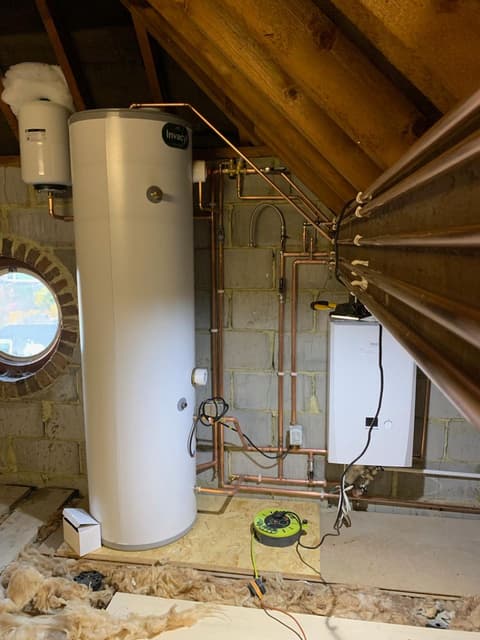 Unvented hot water cylinder and copper pipework installation