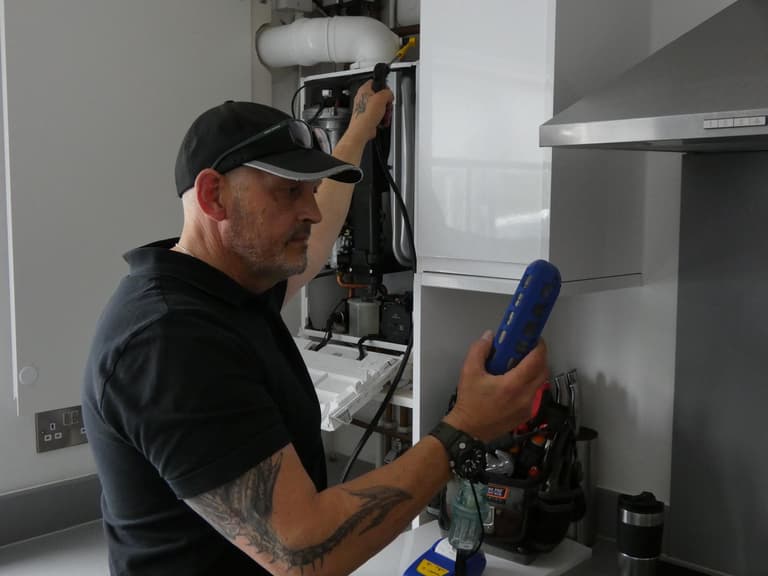 Chris diagnosing a fault with a meter